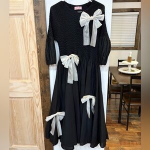 Chic Black Dress with Cream Bows